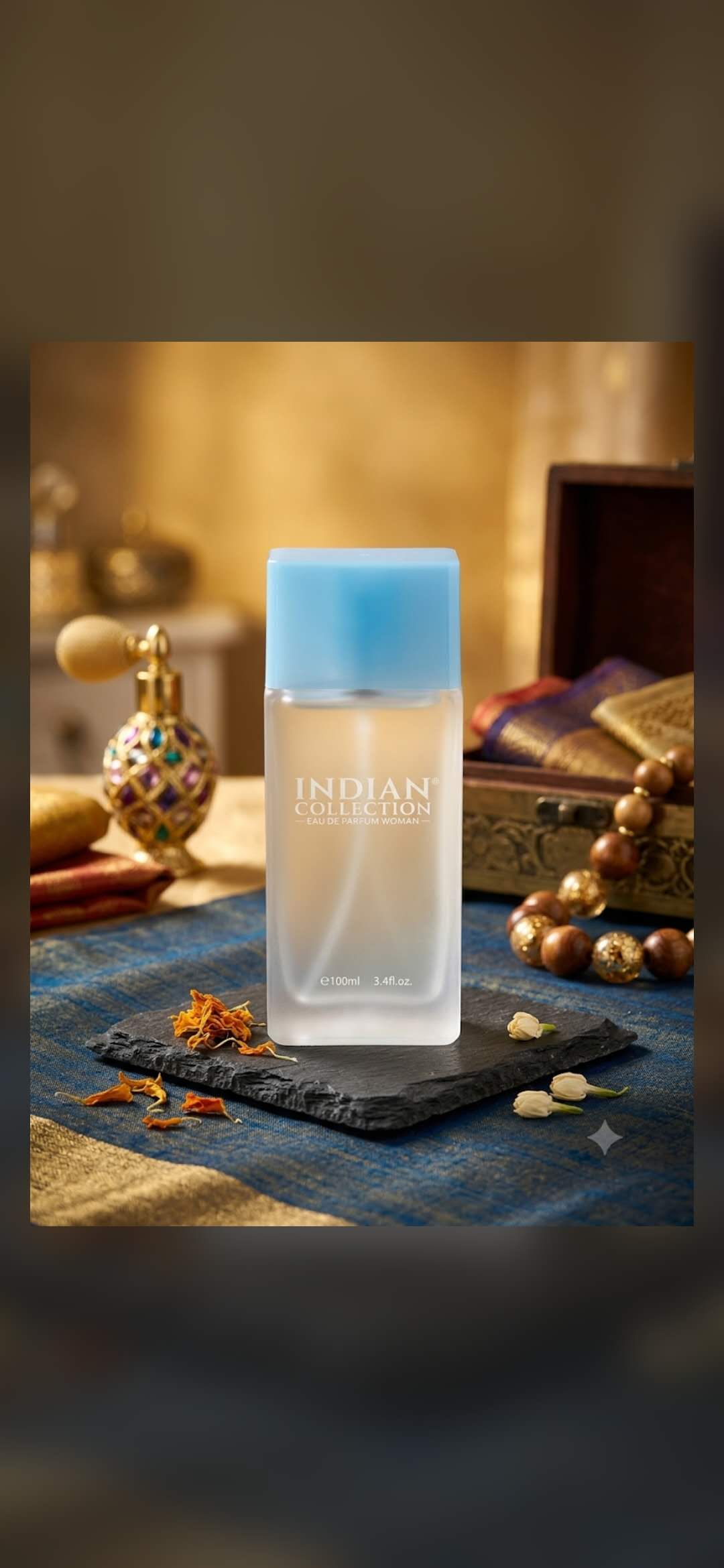 A perfume bottle on richly colored textile with accessories.