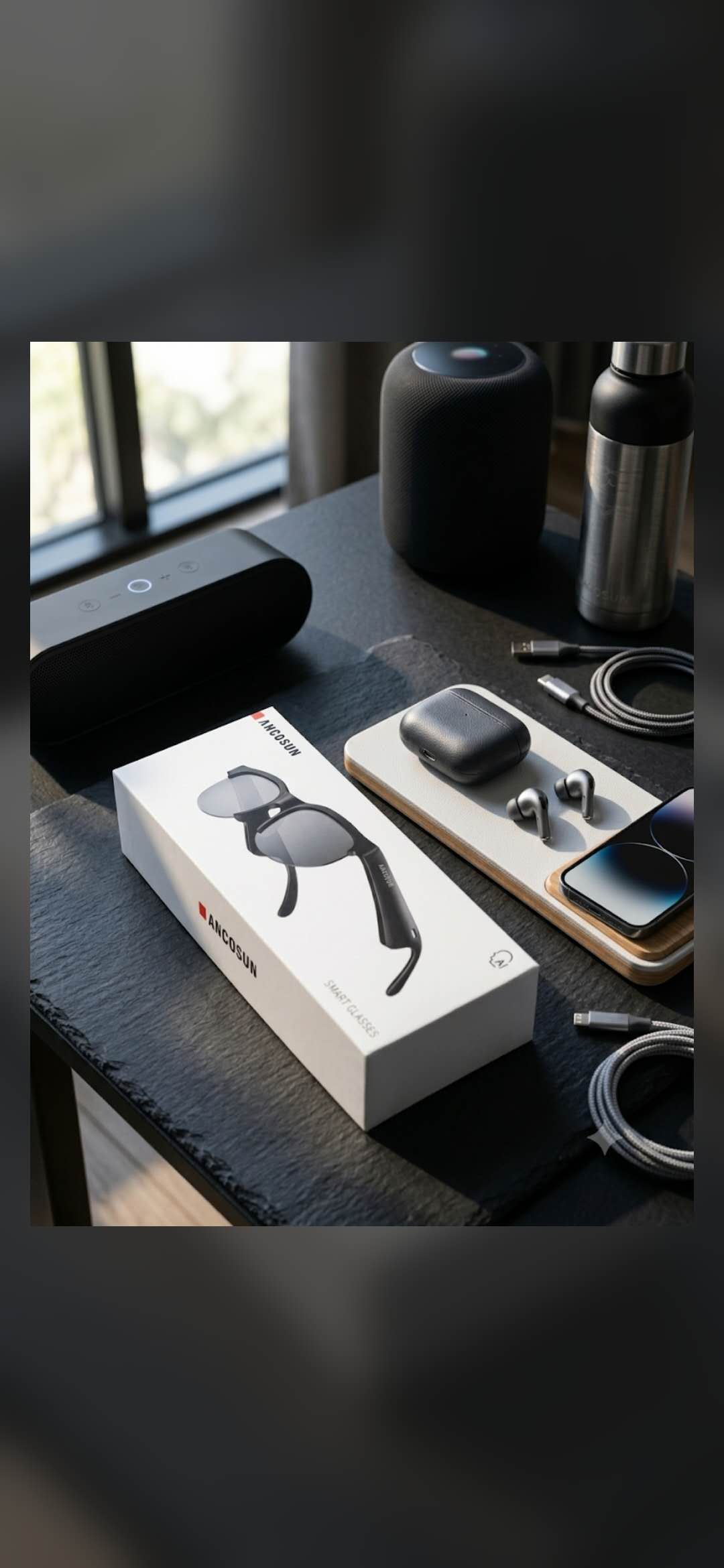 A refined desk setup with smart glasses, earbuds, speaker, phone, and accessories.